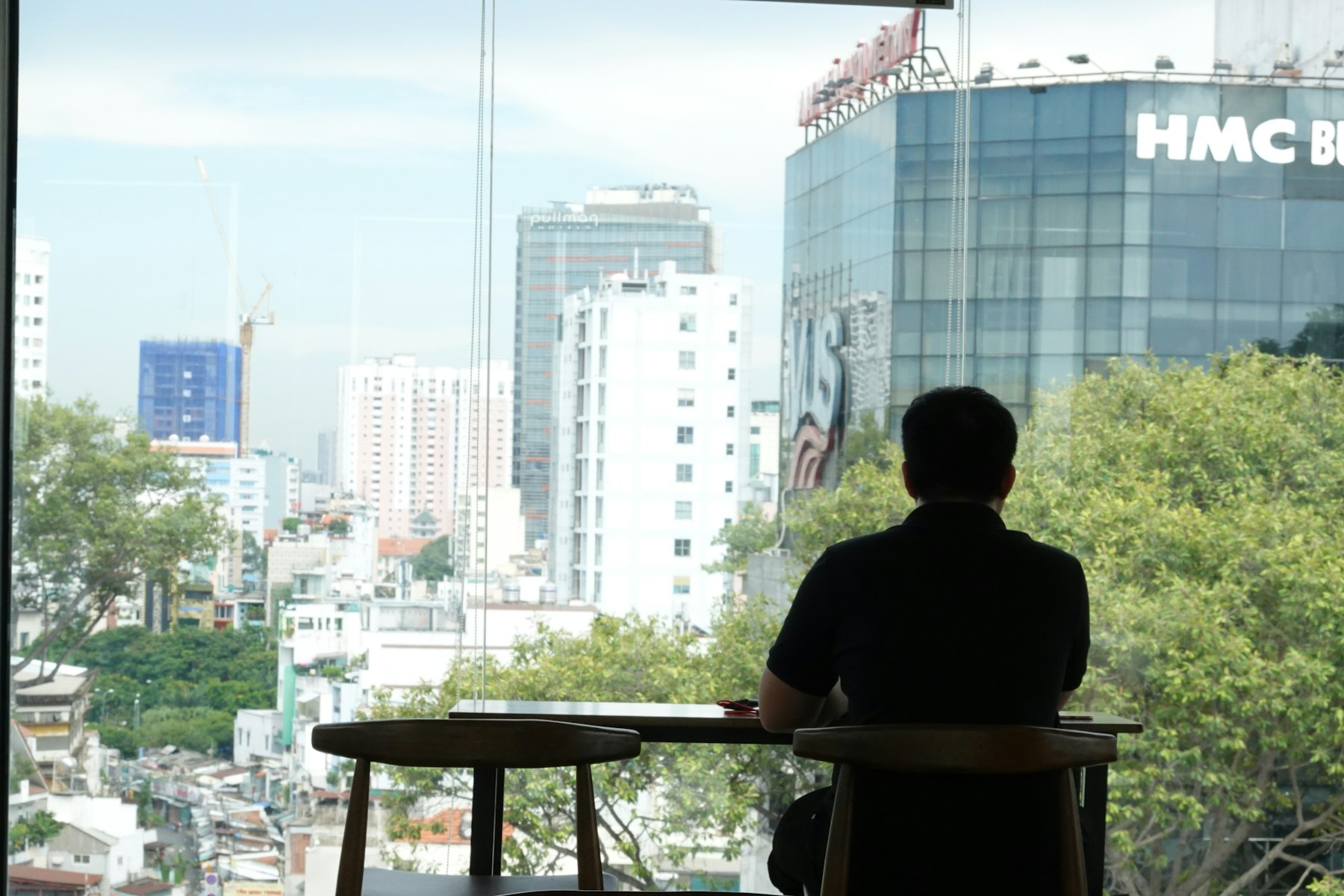 man in black shirt sitting on chair